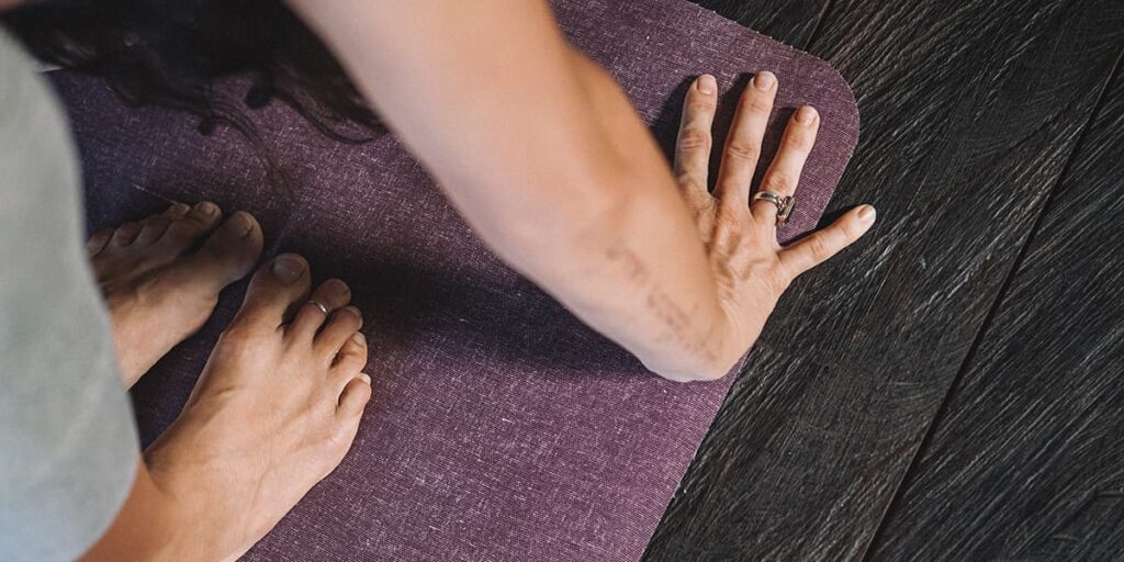 Hands and feet forward fold yoga pose workshop ay yoga 108 Bali