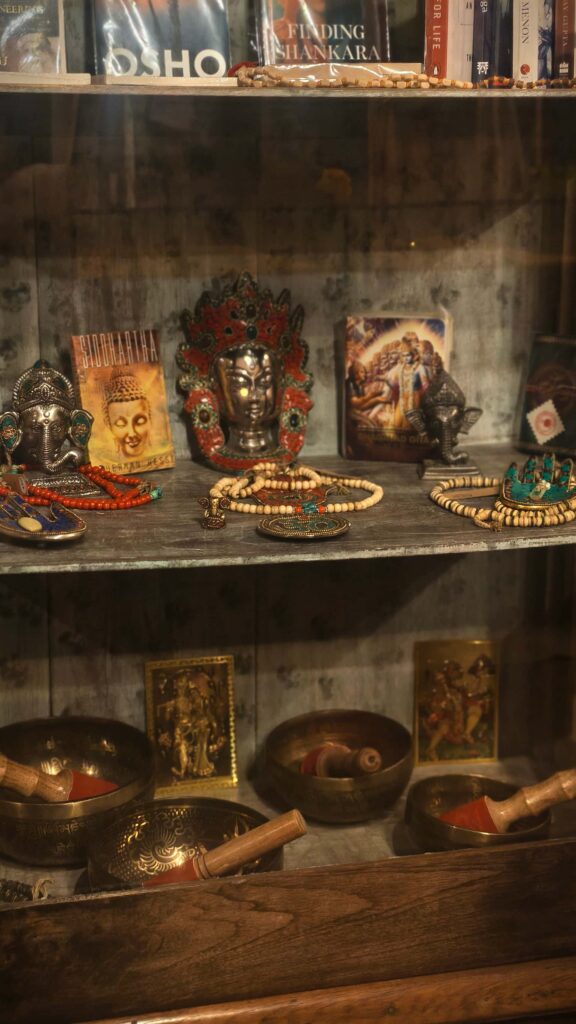 Bookcase with Yoga books and indian crystals and jewelry