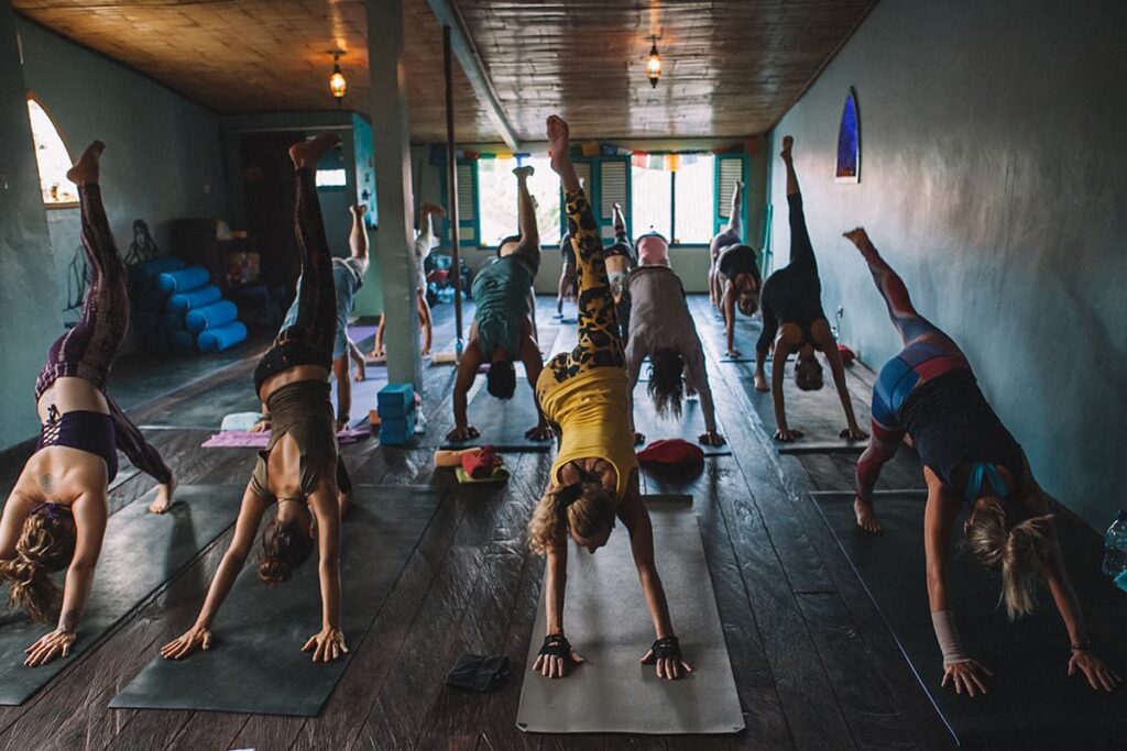 Yoga Group Class in three legged Dog Pose at a Bali Retreat