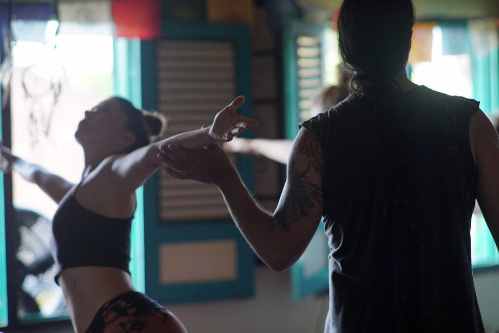 Yoga student being adjusted in workshop training in Bali 108 Studio